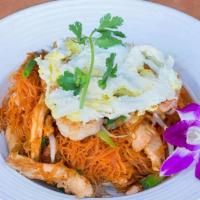 Coconut Stir-Fried Rice Noodles · Rice vermicelli noodles stir-fried with coconut milk in a tamarind sauce with shrimp and chi...