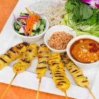 Satay Wraps · Marinated chicken satay served with rice noodles, Thai basil, cilantro, bean sprouts, toaste...