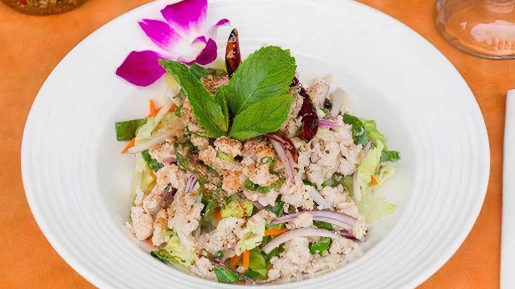 Chicken (Larb) Salad · Minced chicken breast with onions, mint leaves, cilantro roasted rice powder and spicy lime dressing.