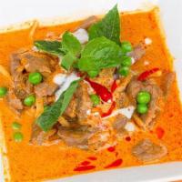 Kang Dang · Red curry. Medium spicy curry with coconut milk, bamboo shoot and Thai basil. Beef, chicken ...