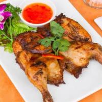 BBQ Chicken · Marinated whole young tender chicken with fresh herbs, served with sweet chili sauce.