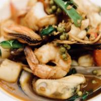 Pad Cha Talay · Sautéed combination seafood (prawns, calamari, scallops, green mussels, and fish) with fresh...