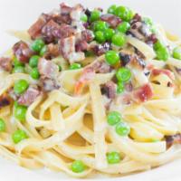 Fettuccine Carbonara · With pancetta, peas and a light Parmesan cheese-cream sauce.