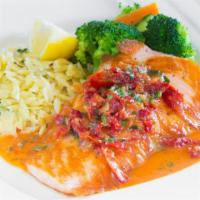 Grilled King Salmon · With chardonnay wine-sun dried tomatoes sauce and basil orzo.