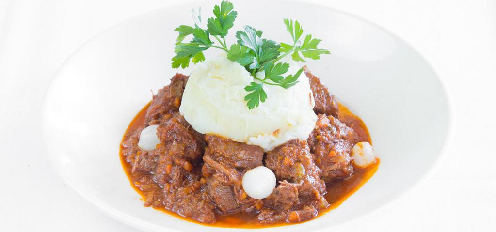 Braised Beef Bourguignon · With potato puree and pearl onions.