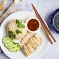 Classic (Khao Man Gai) · Chicken meat served with ginger rice, soy paste sauce, and slices of cucumber