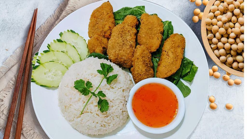 Plant-Based Crispy Chicken · Plant-based chicken katsu on ginger rice, served with sweet and sour sauce. Comes with broth
