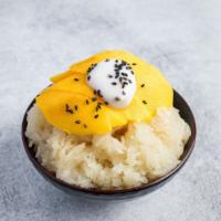 Mango with Sweet Sticky Rice · Mango sticky rice topped with sweet coconut milk and black sesame in an 8 oz cup. The perfec...