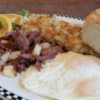 Corned Beef Hash & Eggs · Slow-roasted corned beef brisket, shredded then griddle-fried with potatoes.