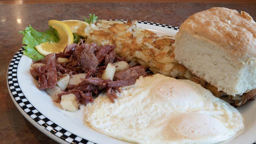 Corned Beef Hash & Eggs · Slow-roasted corned beef brisket, shredded then griddle-fried with potatoes.