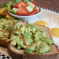 Avocado Toast · Fresh avocado on toasted wheat bread served with 2 eggs* and fresh fruit.