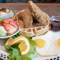 Chicken & Waffle & Eggs · Our secret recipe sweet cream waffle, topped with tender boneless chicken breast, hand-bread...