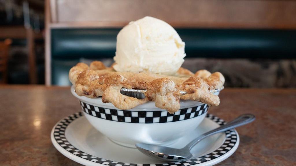 Apple Cobbler · Sweet cinnamon apples topped with a buttery woven lattice crust.