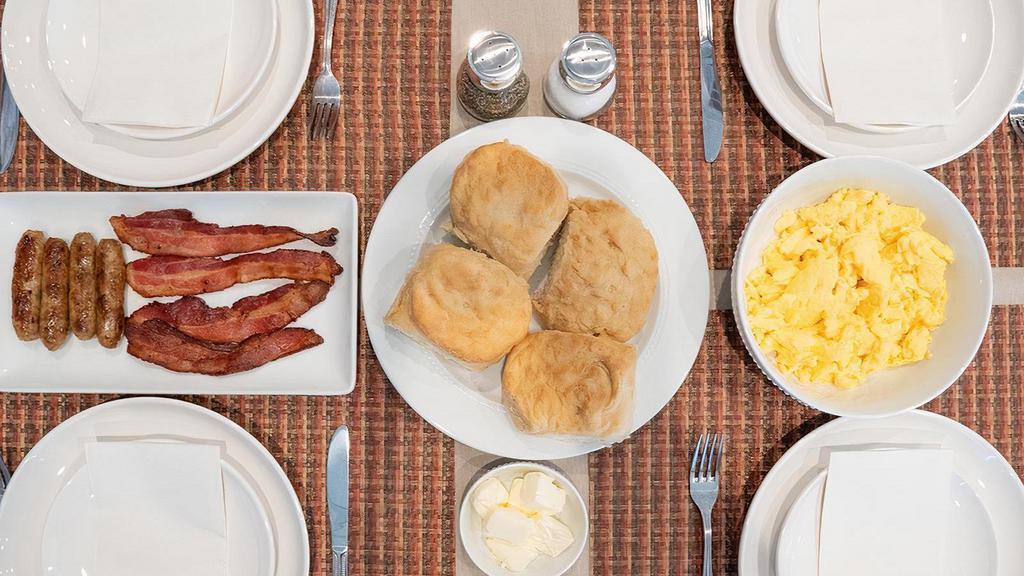 Breakfast Combo Family Meal · 8 Scrambled eggs, 4 slices of thick-cut bacon and 4 link sausages served with 4 housemade biscuits and your choice of strip-cut hash browns or country red potatoes.