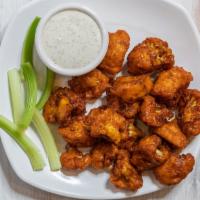 Buffalo Cauliflower Bites (GF/NF) · Battered Cauliflower florets tossed in our buffalo sauce, piled atop spring mix. Served with...