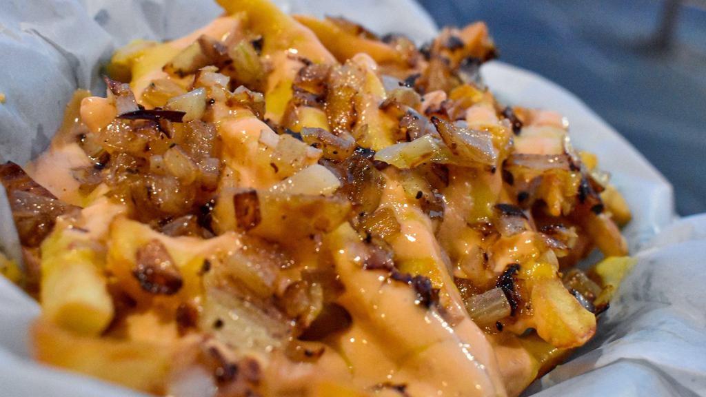 Hangry Fries (GF/NF) · French fries smothered in cheese, thousand island, and grilled onions.