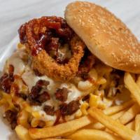 Backyard BBQ Burger · Vegan patty topped with mac and cheese, shredded mozzarella, bacon, fried onion rings, and B...