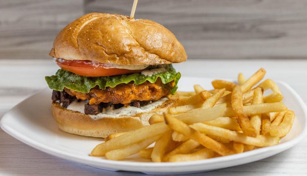 Buffalo Chicken BLT · Breaded soy chick'n patty tossed in buffalo sauce, bacon, lettuce, tomato, and ranch on a toasted pretzel bun.