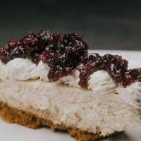 Cheese Cake · Housemade cheesecake with blueberry or strawberry sauce.
