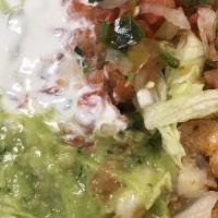 Taco Salad · Rice, beans, sour cream, guacamole, cheese, pico de gallo, lettuce and your choice of meat.