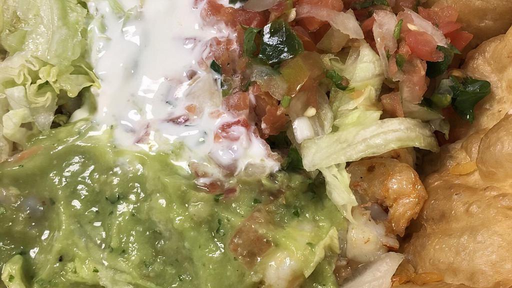 Taco Salad · Rice, beans, sour cream, guacamole, cheese, pico de gallo, lettuce and your choice of meat.