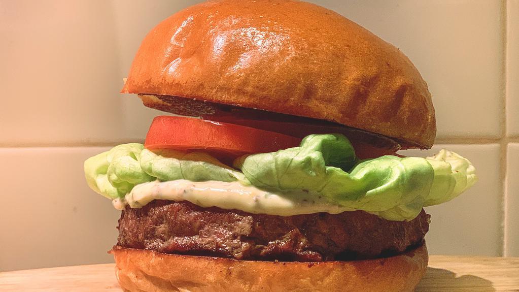 The BA Burger · Half-pound certified angus beef patty, lettuce, tomato, onion, BA secret sauce, and pickles on a brioche bun.