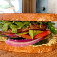 Impossible™ Burger · Imposible plant-based patty, red onion, cucumber, tomato, avocado, chimichurri, arugula, sou...