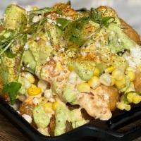 Elote Tots · crispy tots topped with 3-cheese sauce, chipotle ranch, roasted corn, avocado, cilantro crem...