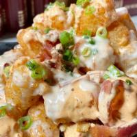 Ba Saucey Tots · Crispy tots with 3-cheese sauce, crispy bacon, chipotle ranch, green onions