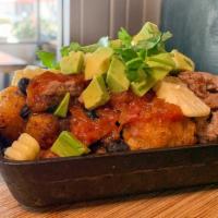 Impossible Sausage Tots (Vegan) · Crispy tots tossed in chorizo spices, stewed black beans, tomato jam, Impossible™ sausage, r...