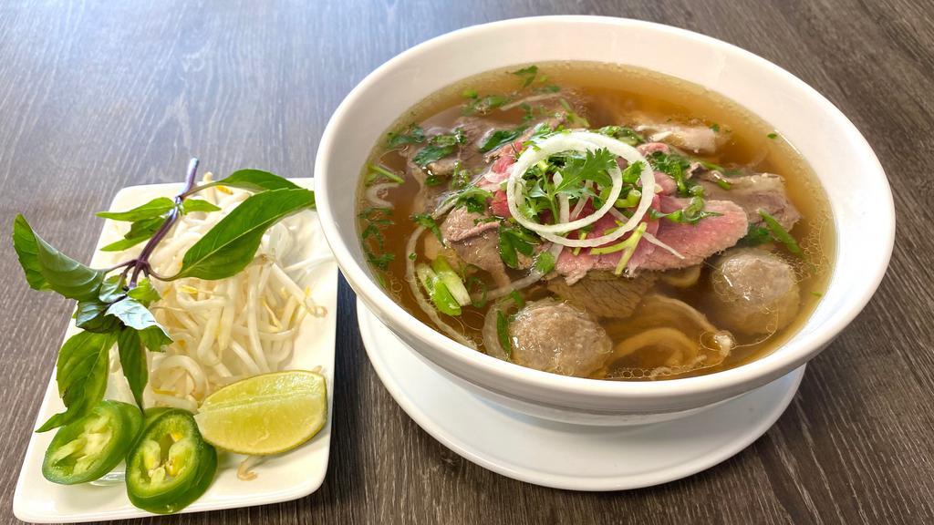 1. Combo Beef Noodle Soup / Pho Đặc Biệt · Beef noodle soup with rare steak, beef balls, brisket, flank, tendon and tripe