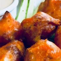 Buffalo Bites · Flash fried, beer battered organic cauliflower, drizzled with spicy buffalo sauce and served...