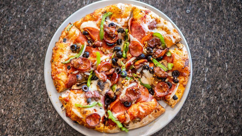 Chuck Wagon (Medium) · Salami, pepperoni mushrooms, black olives green bell peppers, onions, linguica, sausage, beef, and fresh garlic.
