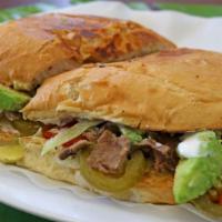 Torta · Choice of meat, onion, sour cream, lettuce, tomato, avocado, and cheese.