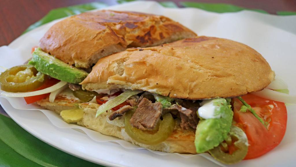 Torta · Choice of meat, onion, sour cream, lettuce, tomato, avocado, and cheese.