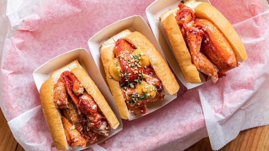 Lobster Roll Flight · Three fun flavors, touching down for a limited time only! 2 oz lemon butter roll, 2 oz spicy Mala roll, and 2 oz truffle butter roll served on half buns. Served with kettle chips.