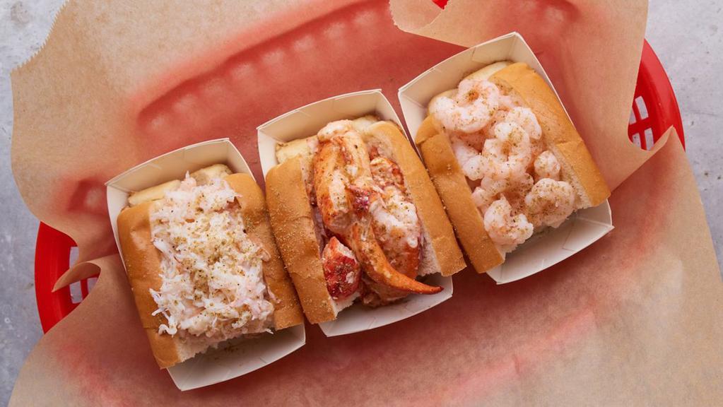 Luke'S Trio · Our seafood sampler! 2oz lobster roll, 2oz crab roll, and 2 oz shrimp roll served on a toasted, buttered half buns with mayo, lemon butter, and Luke's Secret Seasoning. Served with kettle chips.