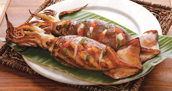 2 Pieces Grilled Whole Squid · 2 pieces of grilled squid stuffed with our signature tomato and onion salsa.