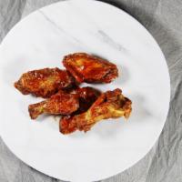 Chicken Wings · Either spicy wings or bbq wings served with a side of ranch dressing.