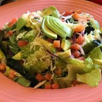 Santa Fe Salad · Romaine heart and spring mix tossed in house vinaigrette topped with Monterey Jack cheese, a...