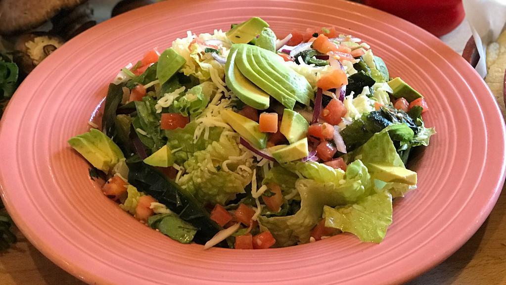 Santa Fe Salad · Romaine heart and spring mix tossed in house vinaigrette topped with Monterey Jack cheese, avocado, pico de gallo, cucumber, and red onion. Served with warm tortillas.