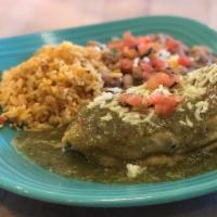 Chile Relleno · Roasted pasilla pepper stuffed with three cheeses, fried in eggs and smothered in oven roast...