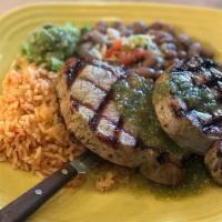 Roasted Pork Loin · Grilled tender pork loins with green roasted tomatillo sauce. Served with tortillas, rice an...