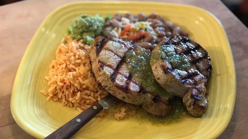 Roasted Pork Loin · Grilled tender pork loins with green roasted tomatillo sauce. Served with tortillas, rice and choice of black or pinto beans.