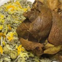 Lamb Shank or Salmon Over Green Rice · Whole lamb shank served with rice cooked with saffron, dill, and lima bean. Similar to bagha...
