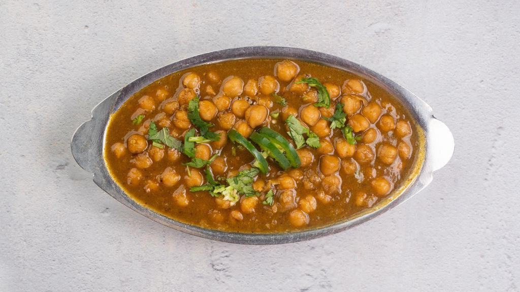 Channa Masala  (VG) · Mildly spiced organic garbanzo beans and caramelized onions, cooked Lahori style. We cannot make substitutions.