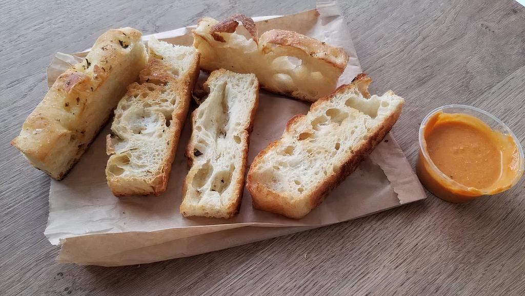 Oven Fresh Garlic Bread · Oven baked Italian bread with roasted garlic, butter and parmigiano cheese