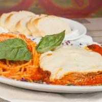 Parmigiana di Pollo · Tender chicken breast served with marinara sauce, mozzarella cheese, and a side of spaghetti...