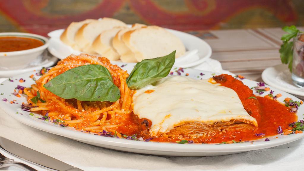 Parmigiana di Pollo · Tender chicken breast served with marinara sauce, mozzarella cheese, and a side of spaghetti pasta