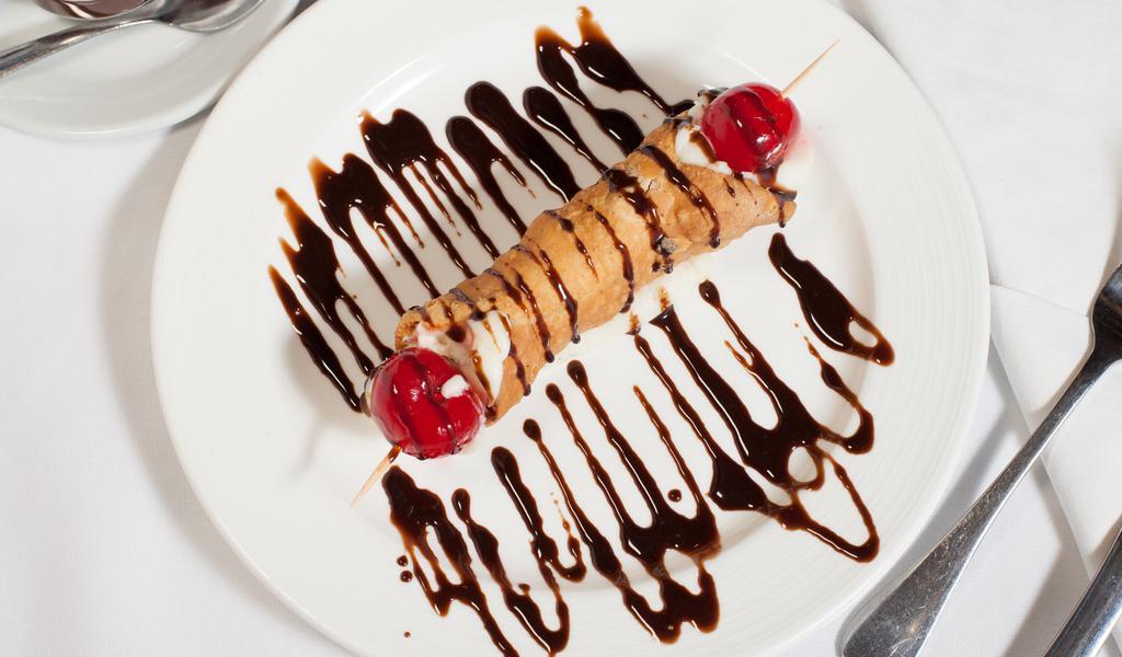 Cannoli · Popular italian dessert cannoli siciliani has a cannoli pastry shell which is filled with sweet creamy ricotta filling